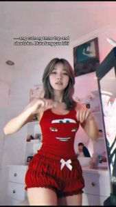 Red tank top with animated car face design and matching red ruffled shorts with white bow.