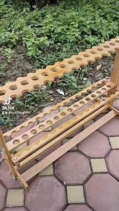 Kệ gỗ cao cấp để cần câu. Loại 47 lỗ