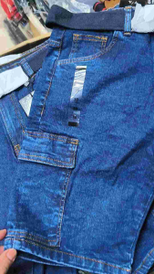 Mens denim shorts with 6 pockets made in Bangladesh featuring cargo pockets and belt loops.