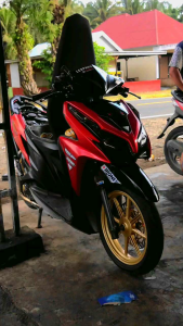 Knalpot Racing DAT Vario Aerox NMax All Matik Inlet38&50 Tipe BlackKG\\n\\n Apa Itu Knalpot Racing DAT Vario Aerox NMax All Matik Inlet38&50 Tipe BlackKG?\\n\\nKnalpot Racing DAT Vario Aerox NMax All Matik Inlet38&50 Tipe BlackKG adalah knalpot yang dirancang khusus untuk motor matik seperti Vario, Aerox, dan NMax. Dengan inlet ukuran 38mm dan 50mm, knalpot ini dapat meningkatkan performa mesin dan memberikan suara yang lebih sporty. Knalpot tipe BlackKG memiliki desain elegan dan kuat, menjadikannya pilihan ideal bagi pengendara yang menginginkan penampilan dan kinerja yang maksimal.\\n\\n Fungsi Utama Knalpot Racing DAT Vario Aerox NMax All Matik Inlet38&50 Tipe BlackKG\\n\\nKnalpot Racing DAT Vario Aerox NMax All Matik Inlet38&50 Tipe BlackKG memiliki beberapa fungsi utama:\\n\\n* Meningkatkan performa mesin motor dengan mengurangi hambatan gas buang\\n* Memberikan suara yang lebih sporty dan menarik\\n* Menambah daya tarik visual pada motor matik\\n* Meningkatkan daya tahan dan kekuatan knalpot\\n\\n Kelebihan Knalpot Racing DAT Vario Aerox NMax All Matik Inlet38&50 Tipe BlackKG\\n\\nBeberapa kelebihan dari knalpot Racing DAT Vario Aerox NMax All Matik Inlet38&50 Tipe BlackKG antara lain:\\n\\n* Didesain khusus untuk motor matik seperti Vario, Aerox, dan NMax\\n* Memiliki inlet ukuran 38mm dan 50mm yang dapat meningkatkan performa mesin\\n* Desain elegan dan kuat dengan warna hitam glossy\\n* Terbuat dari bahan berkualitas tinggi yang tahan lama dan tidak mudah rusak\\n* Dapat meningkatkan daya tarik visual pada motor matik\\n\\n Bagaimana Memilih Knalpot Racing DAT Vario Aerox NMax All Matik Inlet38&50 Tipe BlackKG yang Berkualitas Tinggi?\\n\\nUntuk memilih knalpot Racing DAT Vario Aerox NMax All Matik Inlet38&50 Tipe BlackKG yang berkualitas tinggi, perhatikan beberapa hal berikut:\\n\\n* Pastikan knalpot memiliki ukuran inlet yang sesuai dengan motor Anda (38mm atau 50mm)\\n* Cek kualitas bahan pembuat knalpot, pastikan terbuat dari bahan berkualitas tinggi yang tahan lama\\n* Perhatikan desain dan warna knalpot, pilih yang sesuai dengan selera dan preferensi Anda\\n* Pastikan ada garansi atau jaminan kualitas dari produsen\\n\\n Cara Pasang Knalpot Racing DAT Vario Aerox NMax All Matik Inlet38&50 Tipe BlackKG\\n\\nBerikut langkah-langkah pasang knalpot Racing DAT Vario Aerox NMax All Matik Inlet38&50 Tipe BlackKG:\\n\\n1. Pastikan motor dalam keadaan mati dan dingin\\n2. Cabut kabel busi dan isolasi kabel\\n3. Cabut knalpot standar dan ganti dengan knalpot Racing DAT Vario Aerox NMax All Matik Inlet38&50 Tipe BlackKG\\n4. Pasang kembali kabel busi dan isolasi kabel\\n5. Tes motor setelah pemasangan selesai\\n\\n Perawatan Knalpot Racing DAT Vario Aerox NMax All Matik Inlet38&50 Tipe BlackKG\\n\\nUntuk menjaga kualitas dan keawetan knalpot Racing DAT Vario Aerox NMax All Matik Inlet38&50 Tipe BlackKG, lakukan perawatan sebagai berikut:\\n\\n* Bersihkan knalpot secara rutin dari kotoran dan karat\\n* Gunakan produk pembersih khusus knalpot\\n* Hindari menginjak knalpot saat parkir\\n* Jika ada kerusakan, segera ganti atau perbaiki\\n* Ikuti petunjuk pemeliharaan dari produsen\n}