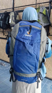 Deuter Jupiter 60L backpack with free rain cover multiple compartments adjustable straps durable material suitable for hiking and travel.