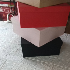 Red square gift boxes 10x10x4 inches. Four boxes stacked. Brand logo on top. White background.