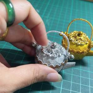 โปรยทานกาน้ำโบราณแพ็ค 10 ชิ้น (ตัวเปล่าใส่เหรียญที่หลัง)