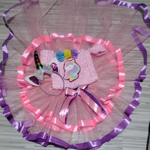 Unicorn-themed pink knitted dress with tutu skirt and ribbon accents.
