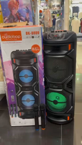 Portable multimedia speaker with wireless microphone support Bluetooth USB AUX. Super bass feature. Black color. Blue LED lights. Control knobs on top.