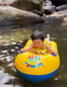 Inflatable Floating Pool Air Mattress Swimming Float Hammock Pelampung Tilam budak 漂浮床. Blue pink and yellow colors. Circular headrests. Text "HAPPY" and "A B C" visible. Outdoor setting.