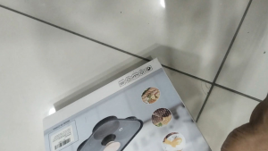 MR DIY Frying Pan with wooden handle and four compartments for cooking.