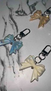 Ines Bow Glossy Keychain: Gantungan Kunci Pita Coquette untuk Aksesori Fashion Warna Soft