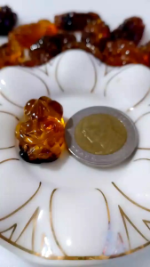 ปี่เซี๊ยะงานแกะสลักจากอำพันพม่าแท้ค่ะ