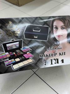 Kiss Touch cosmetics makeup kit with eyeshadow palette brush set and compact case. Perfect for creating glamorous looks.