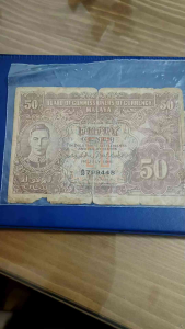 100% Authentic Collectables 1941 Malaya Straits Settlement 50 cent old note  *Actual photo taken not from library   *Catlogue #ssn 0127  *Condition: Well Used    Issuer: Malaya (Malaysia)   King: George VI (1936-1952)  Type: Standard circulation banknotes