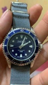 Đồng hồ nam JAXIS SUNFLAME QUARTZ size 40mm cả núm 43mm mặt xanh niềng khía có xoay kim cọc số có hỗ trợ dạ quangđáy xoáy chống nước tốt 10BAR dây dù thay mới tạo phong cách thể thao và trẻ trung