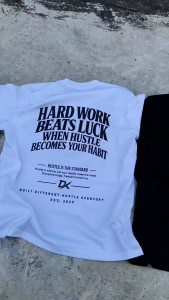 Black T-shirt with motivational text on back and small logo on front. Casual wear for daily use.