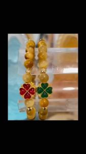 Vòng tay chuỗi hạt đá thạch anh mắt hổ vàng thiên nhiên mic charm 4 lá may mắn