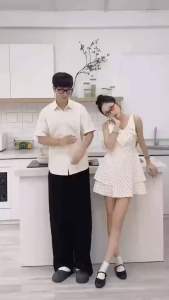 Set đồ đôi sơmi nam màu kem phối váy nữ chấm bi cổ tim dáng xoè tay sát nách