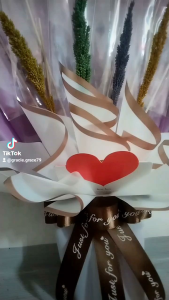 Ready made empty money bouquet with Fairy Lights. Red and gold wrapping butterfly decorations "Happy Birthday" tag festive scene.