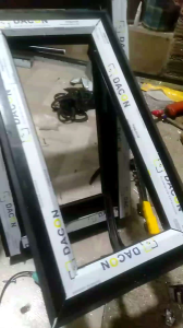 JENDELA ALUMINIUM KACA UKURAN T100xL50 MODEL JUNGKIT/SWING MOTIF ORNAMEN