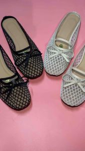 Sam Black and white mesh slip-on shoes with bows. Flat design for casual wear.