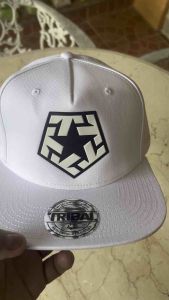 Tribal Snapback Cap (original) white with black logo fit for casual wear in a clothing store