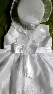 Baptismal Dress in Fine Fabrics with Bow Detail: A Sleeveless Cut for Comfort Wearing of Your Princess During Christening Day
