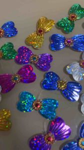 เลื่อมโบว์คละสีติดสังวาลย์ จำนวน 50 ชิ้น