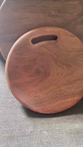 Wooden round cutting boards set with handle smooth surface natural grain stackable kitchen use.