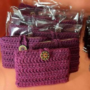 Handmade crochet card wallet/pouch with button closure.