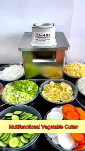 Stainless steel commercial kitchen vegetable cutter with slicing and chopping functions. Ideal for efficient food preparation in professional kitchens.
