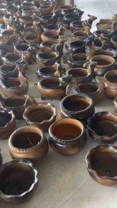 Chậu củ bình vôi Chăm Pa hình con vật đã lên mầm