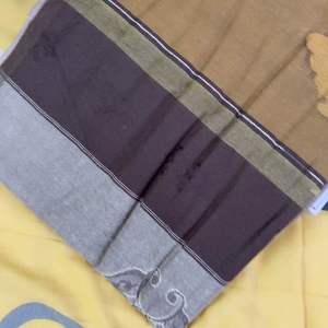 Kain pelikat gajah duduk signature