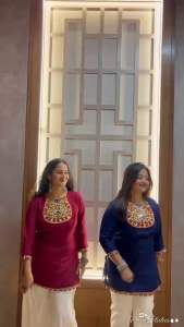 Rayon cotton mirror work short kurti for Navratri Garba with lace work. Maroon color with colorful embroidery on neckline and sleeves. White pants.