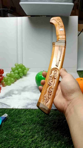 Pisau sembelih model tarisi kayu jati