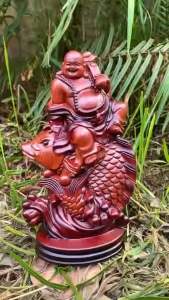 Tượng Phật Di Lặc cưỡi cá chép biểu tượng sự may mắn tài lộc và hạnh phúc gỗ hương kích thước cao 23-13-8cm