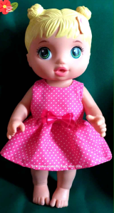Pink/red/coral/blue polka dot baby doll dress with bow for 11 to 12 inch dolls.