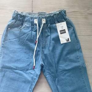Comfortable Wide -Leg Denim Jeans For Women with Drawstring Waist and Pockets