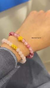 Put3Gold Colour beaded bracelet with gold charm on wrist.