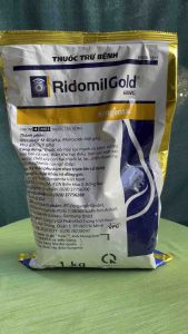 Thuốc trừ bệnh Ridomil Gold 68wg- syngenta ( gói 1kg ) trị bệnh sương mai hại ca cao thán hư hại điều loét sọc nặt cạo cao su chết cây con hại thuốc lá lạc chết nhanh hại hồ tiêu đốm lá hại ngô ( bắp )