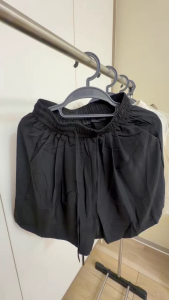 Drawstring shorts with elastic waistband and side pockets. Casual wear for warm weather.