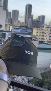 DRIFIT BASEBALL CAP with BOSS logo perforated design curved brim casual wear sports scene.