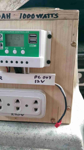 New build solar generator 1000 watts with built-in LiPo4 battery 50Ah preloved. Wooden casing digital display USB ports 13V DC output 230V AC outlet. Suitable for outdoor use.