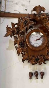Jam dinding ukiran jati model anggur