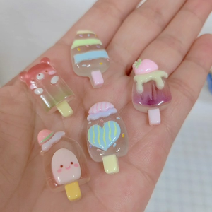 Bear-shaped ice cream popsicle with pastel colors and cute designs.