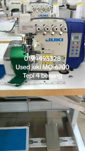 Used Juki MO-6714S overlock 4 thread sewing machine direct drive