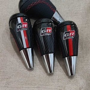 หัวเกียร์ออโต้ toyota ทำเคฟล่าผ้าแท้ GR Sport แบบเต็มหัว แยกชิ้นบนล่าง หนังดำ เย็บด้ายแดง แบบไขว้