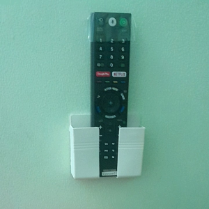 Hộp Đựng Remote Điện Thoại Có Lỗ Cắm Sạc Dán Tường