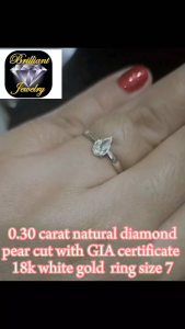 0.30 carst Pear-shaped diamond engagement ring with GIA certification featuring 0.50 carat weight 71% depth 50.5% table and SK Au750 band.size 7 wg 18k