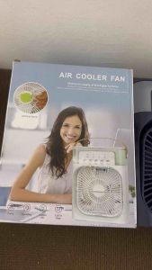 Air Cooler Fan with green accents for desk use in home setting.