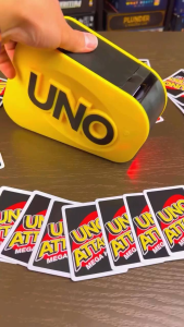 UNO Attack Mega Hit Card Game with Random-Action Launcher with Lights & Sounds & 112 Cards Kid Teen & Adult Game Night Gift Ages 7 Years & Older 