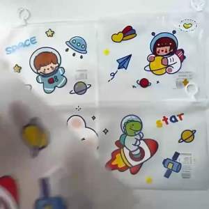 Transparent pencil case with space theme featuring astronaut and planets. Holds stationery items. Suitable for school or office use. Bag comel tempat pensil pemadam pengasah