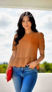 Elisha Peplum blouse with puff sleeves and ruffled hem. Casual wear for everyday use.